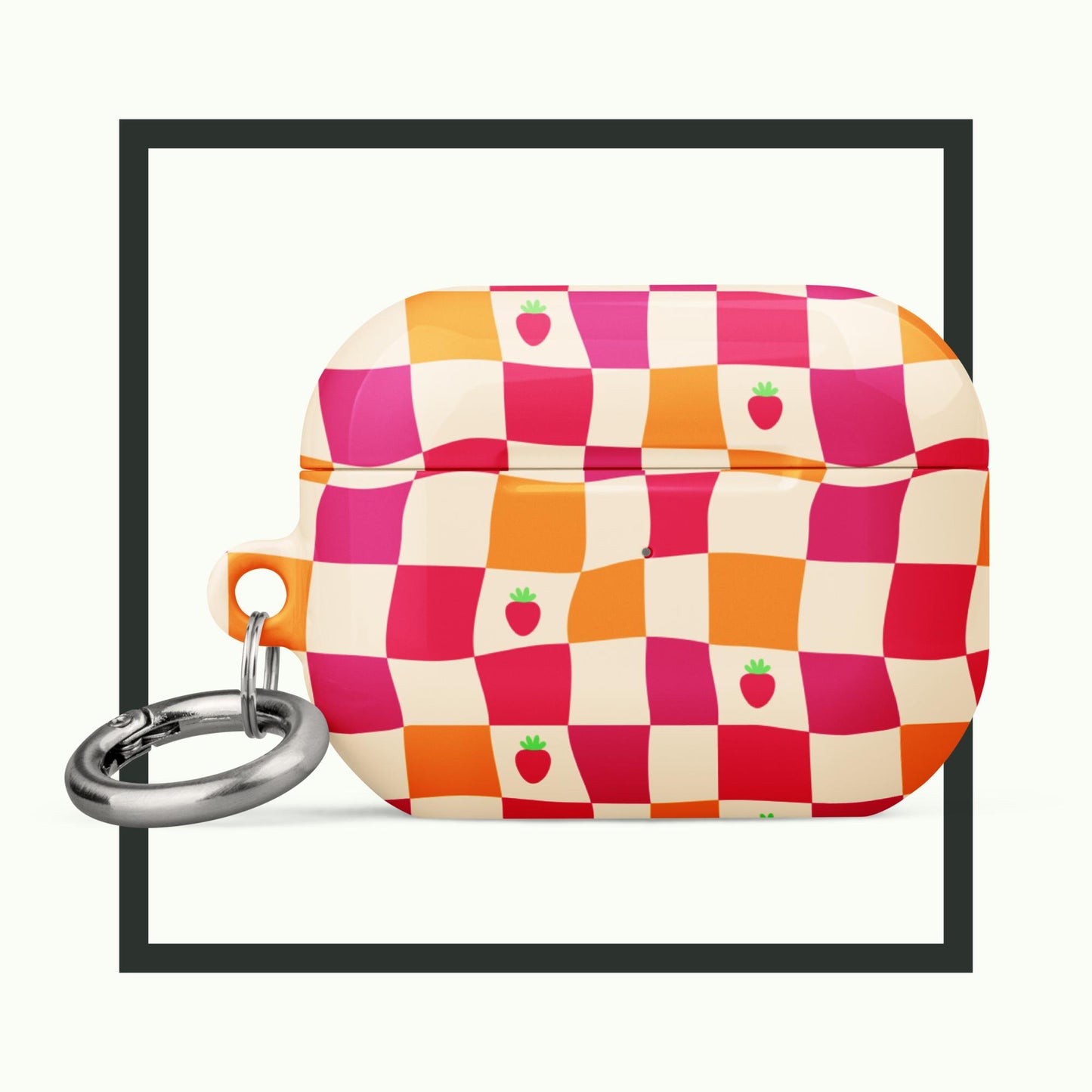 An AirPods® case with a vibrant wavy checkerboard design in pink, orange, and cream, accented with cute strawberry illustrations. The case includes a metal carabiner and offers stylish, impact-absorbing protection. Perfect for a playful and functional accessory!