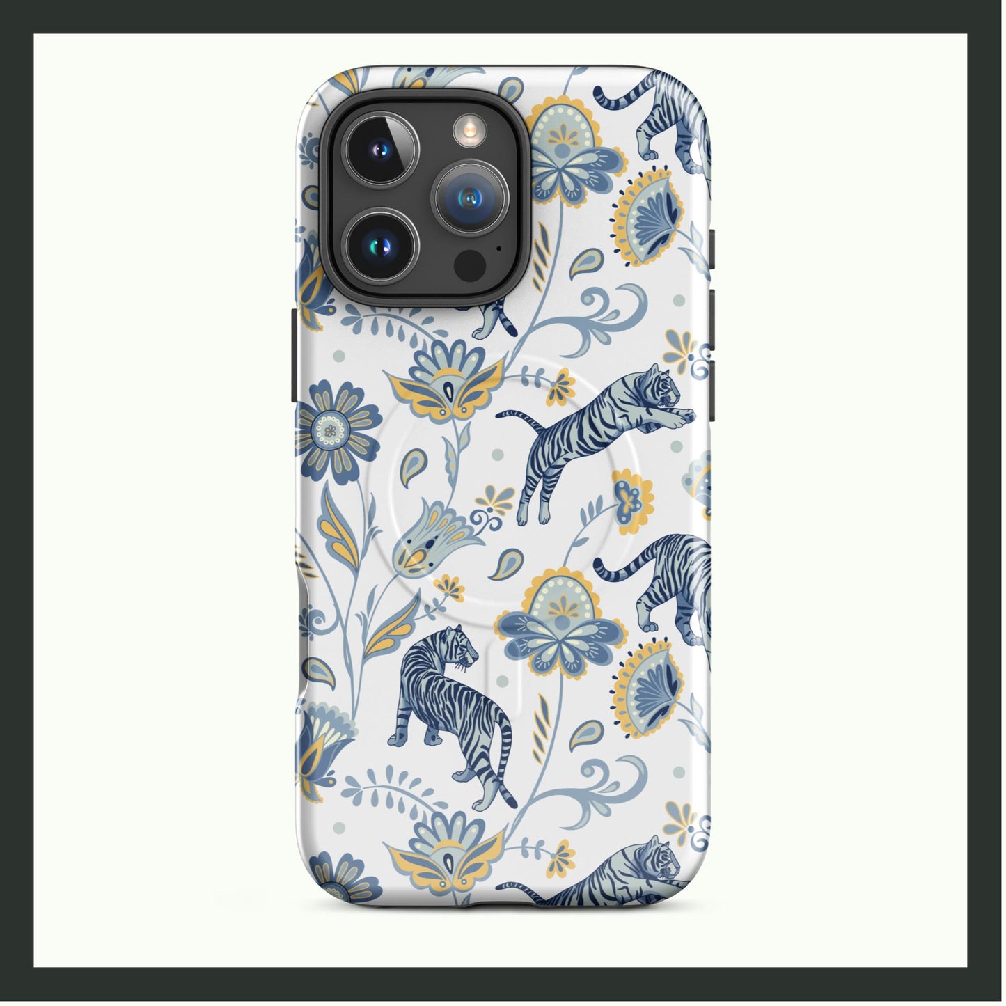 A MagSafe® tough iPhone® case featuring an artistic design of blue tigers surrounded by intricate yellow and blue floral patterns on a white background. This dual-layer case offers durable protection with an elegant and nature-inspired look!