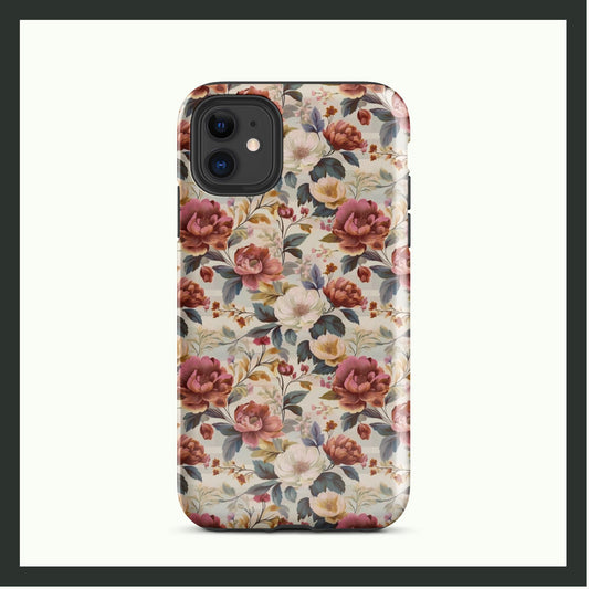 ANTIQUE BLOOM vintage floral iPhone® tough case featuring elegant pink, white, and yellow flowers with lush greenery, offering timeless style and dual-layer protection.