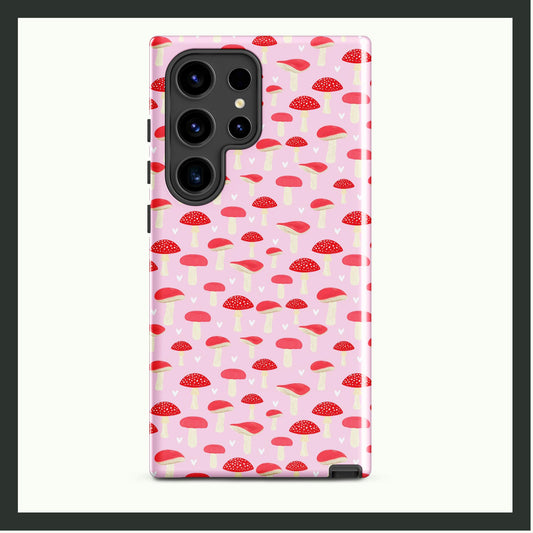 A tough Samsung® phone case featuring a playful red and white mushroom pattern on a pastel pink background. This dual-layer case provides stylish charm and reliable protection, perfect for nature lovers and unique designs!